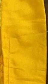 A yellow cloth with some writing on it